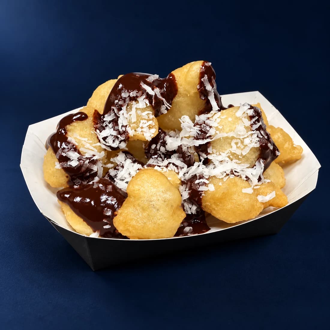 Studio-retouched photo of Zeus loukoumades with chocolate and shaved coconut